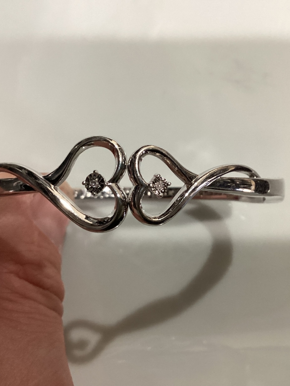 Sterling Silver Plated Double Heart Bracelet with Diamond Solitaires.